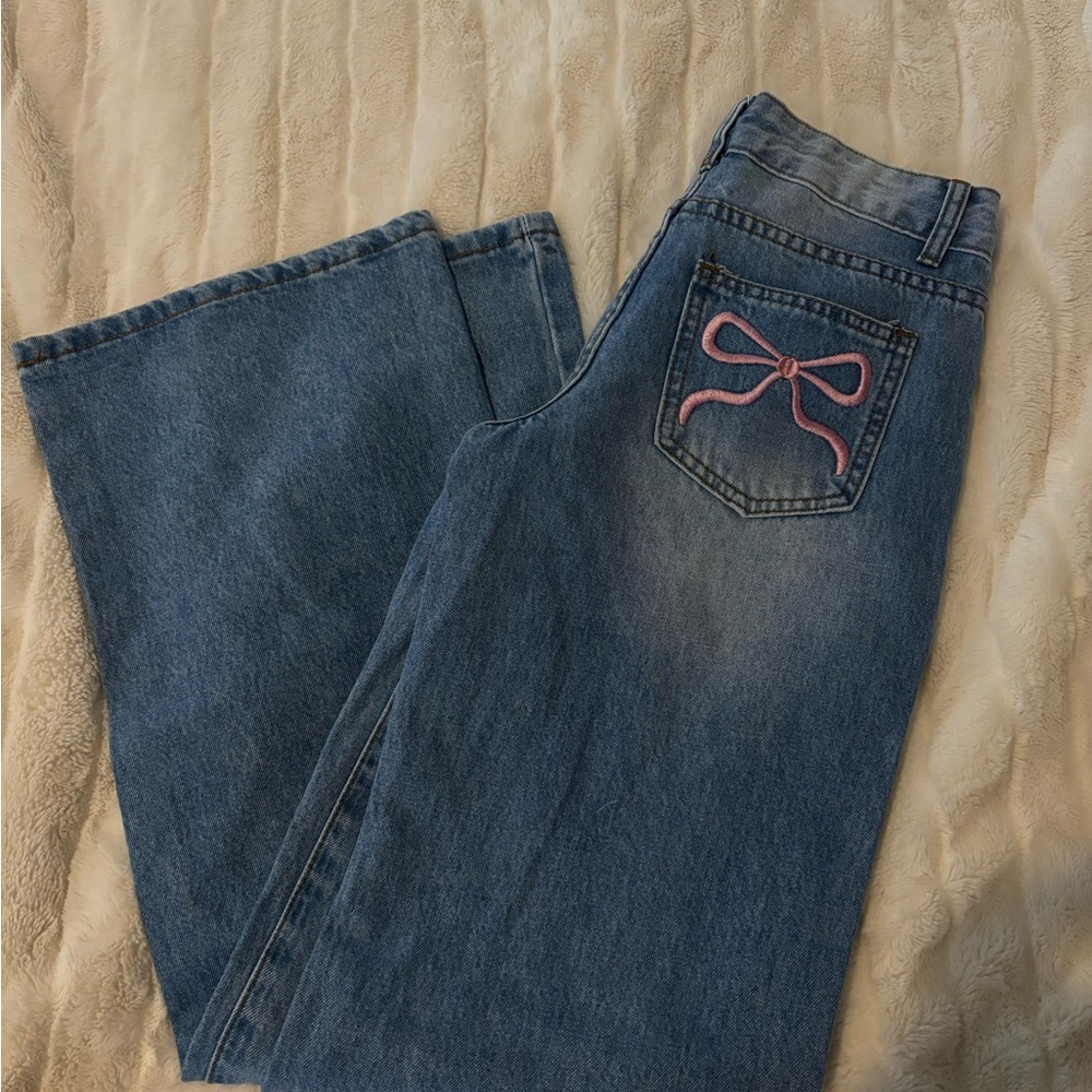Stylish Blue Flare Jeans with Pink Bow Accent